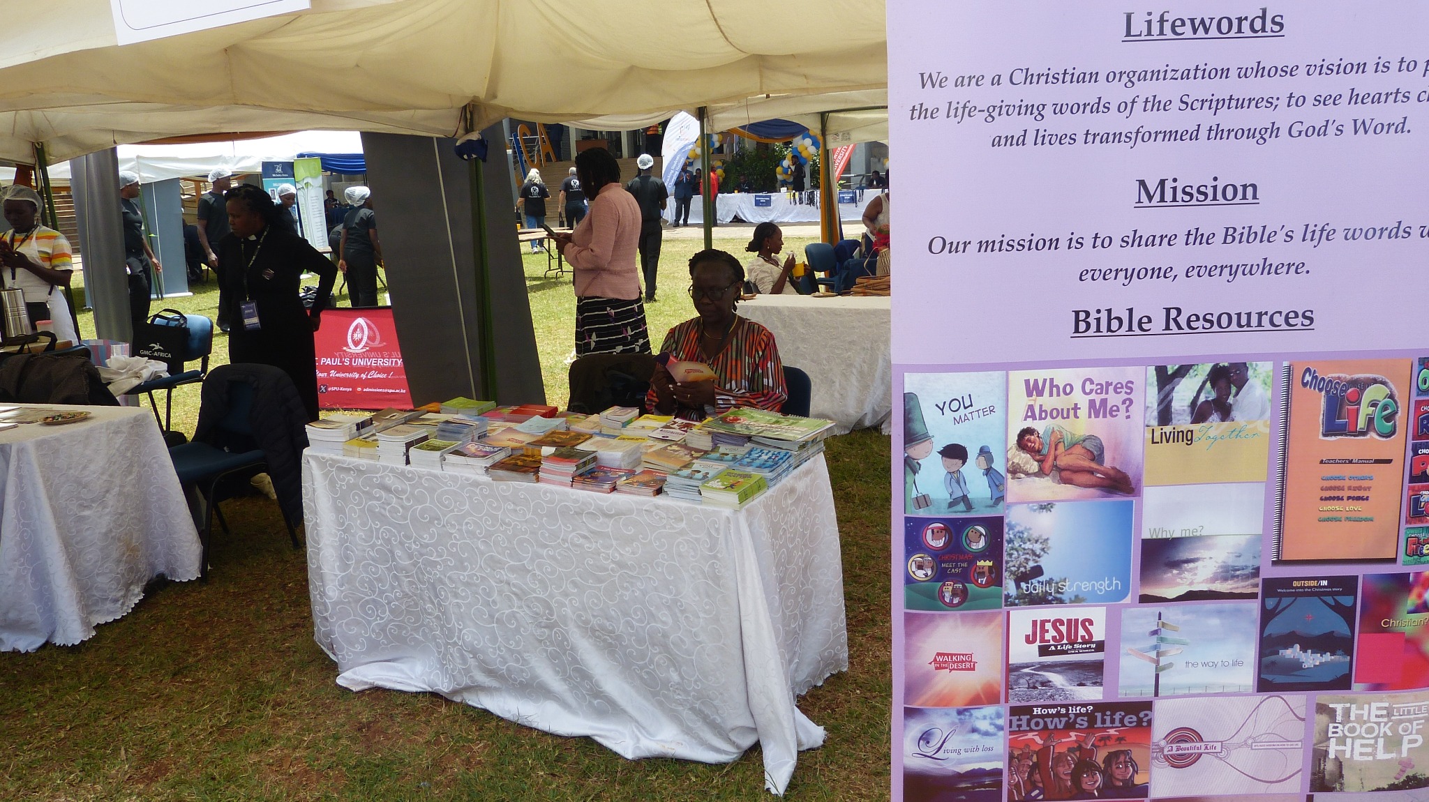Lifewords Bible-based books and ministry materials displayed at an outreach event